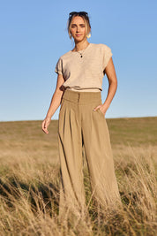 Model Tegan wearing size 10 of the High Flying Wide Leg Pants in colour Pumice, from the front, showing the whole outfit