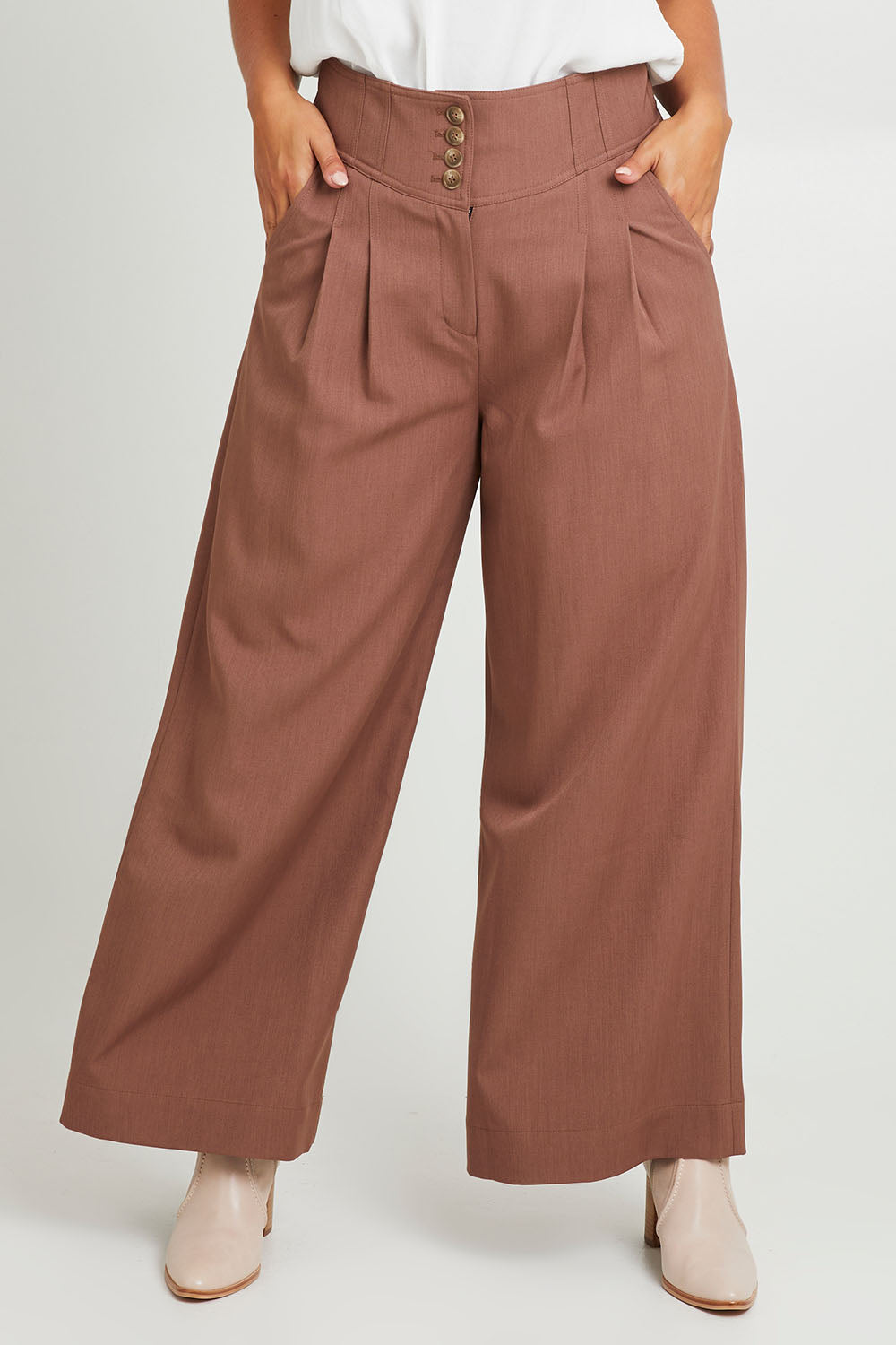 Model Monique wearing size 14 of the High Flying Wide Leg Pants in colour Walnut, from the front, cropped image