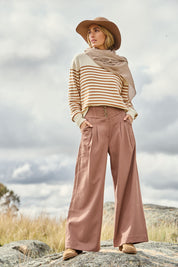 Model Tegan wearing size 10 of the High Flying Wide Leg Pants in colour Walnut, from the front, showing the whole outfit