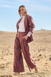 Model Tegan wearing size 10 of the High Flying Wide Leg Pants in colour Wood, from the front, showing the whole outfit