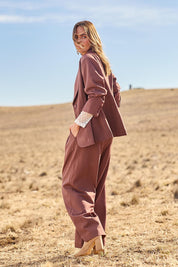 Model Tegan wearing size 8 of the High Flying Wide Leg Pants in colour Wood, from the front, showing the whole outfit