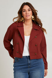 Model Laura wearing size 14 of the Coffee Date Jacket in colour Rust (Red), from the front, cropped image