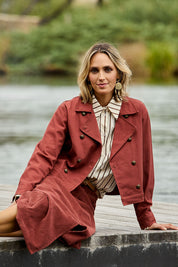 Model Tegan wearing size 10 of the Coffee Date Jacket in colour Rust (Red), from the front, showing the whole outfit