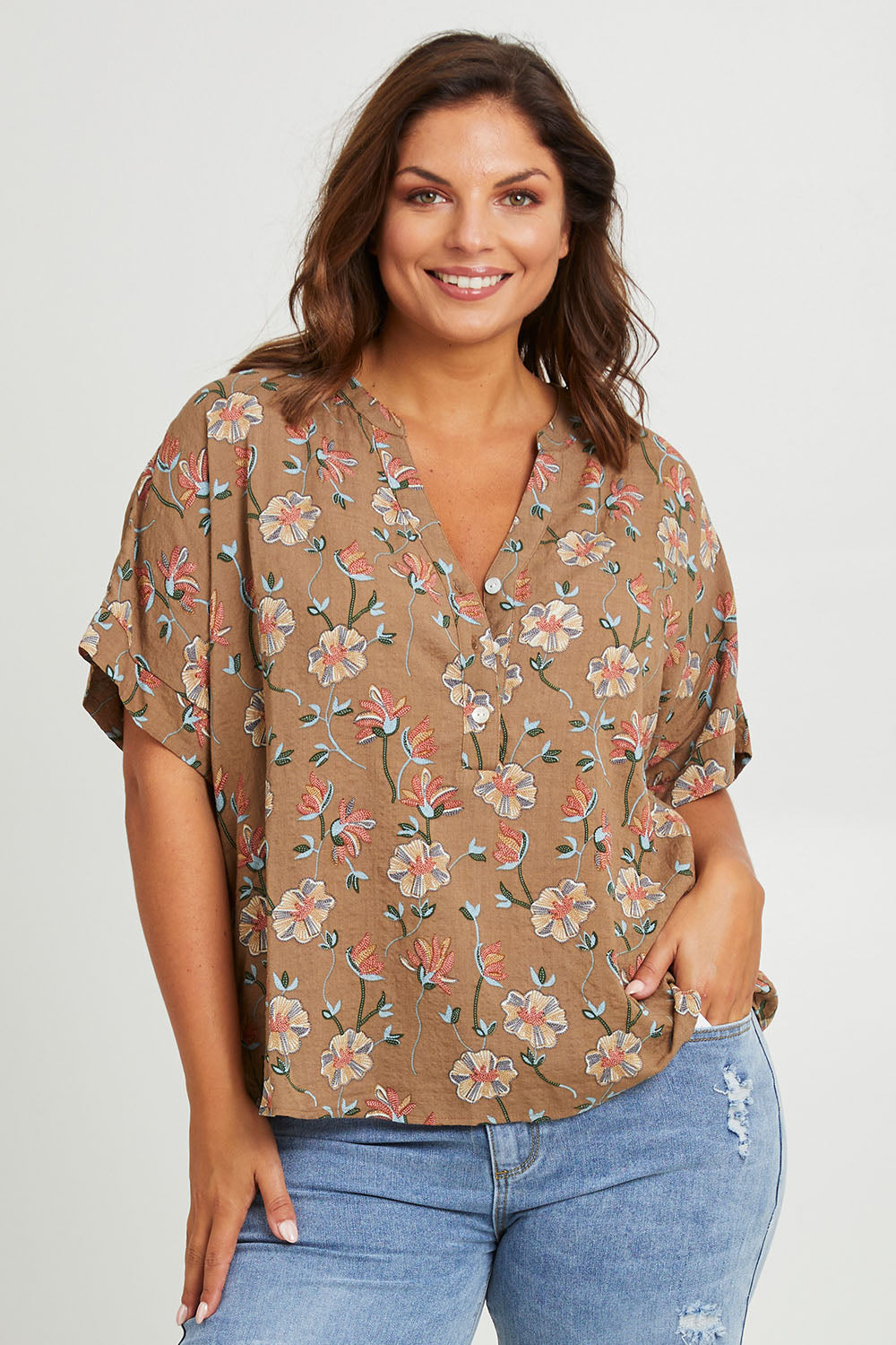 Model Monique wearing size 14 of the Flower Chain Slouch Top in colour Fleur, from the front, cropped image