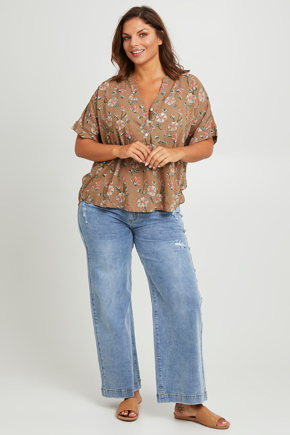 Model Monique wearing size 14 of the Flower Chain Slouch Top in colour Fleur, from the front, showing the whole outfit