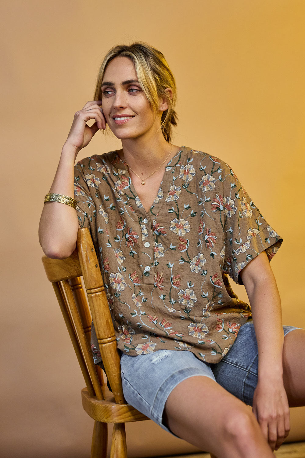 Model Tegan wearing size 10 of the Flower Chain Slouch Top in colour Fleur, from the front, showing the whole outfit