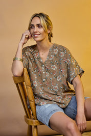 Model Tegan wearing size 10 of the Flower Chain Slouch Top in colour Fleur, from the front, showing the whole outfit