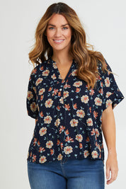 Model Laura wearing size 14 of the Flower Chain Slouch Top in colour Navy (Blue), from the back