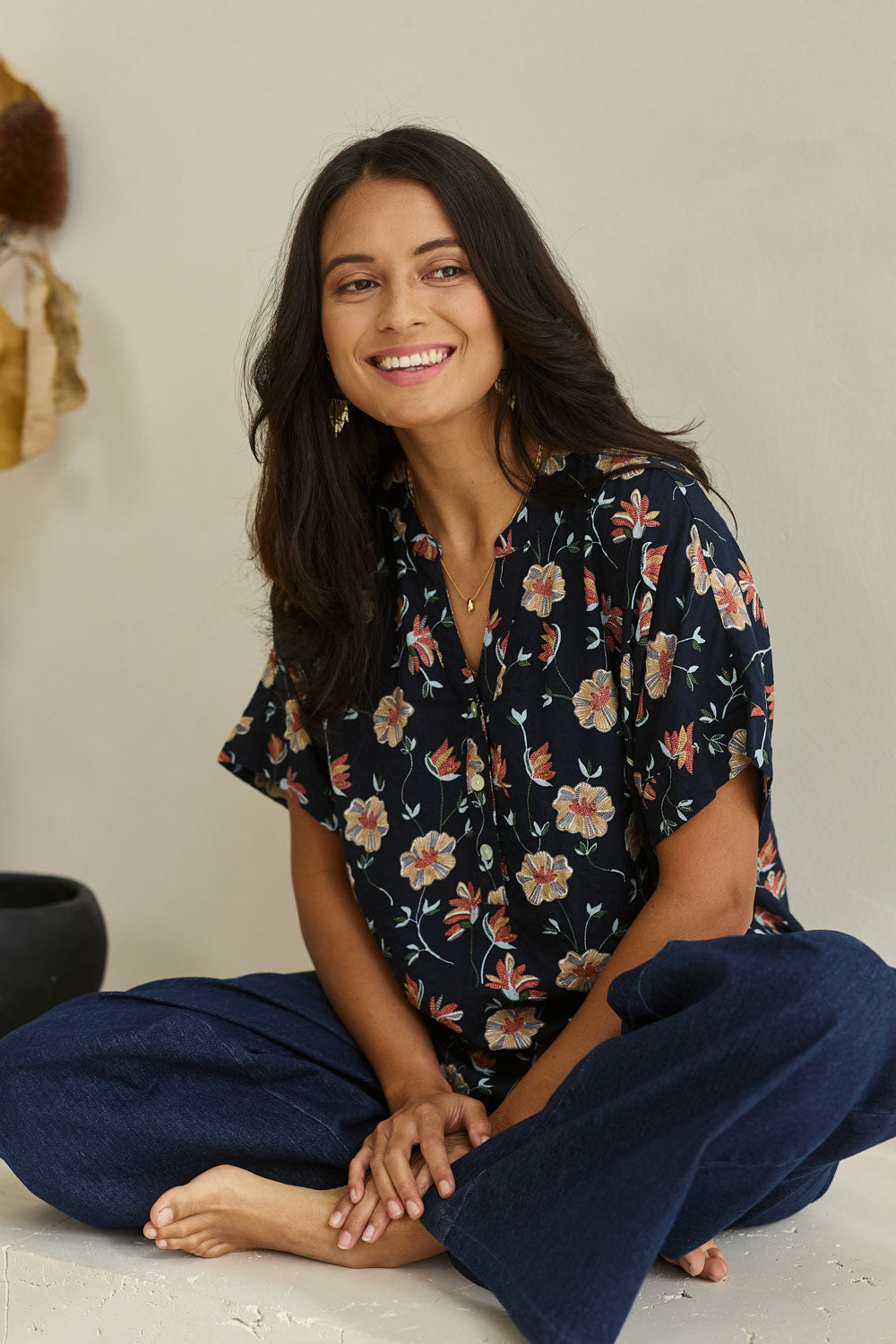 Model Tahnee wearing size 10 of the Flower Chain Slouch Top in colour Navy (Blue), from the front, showing the whole outfit