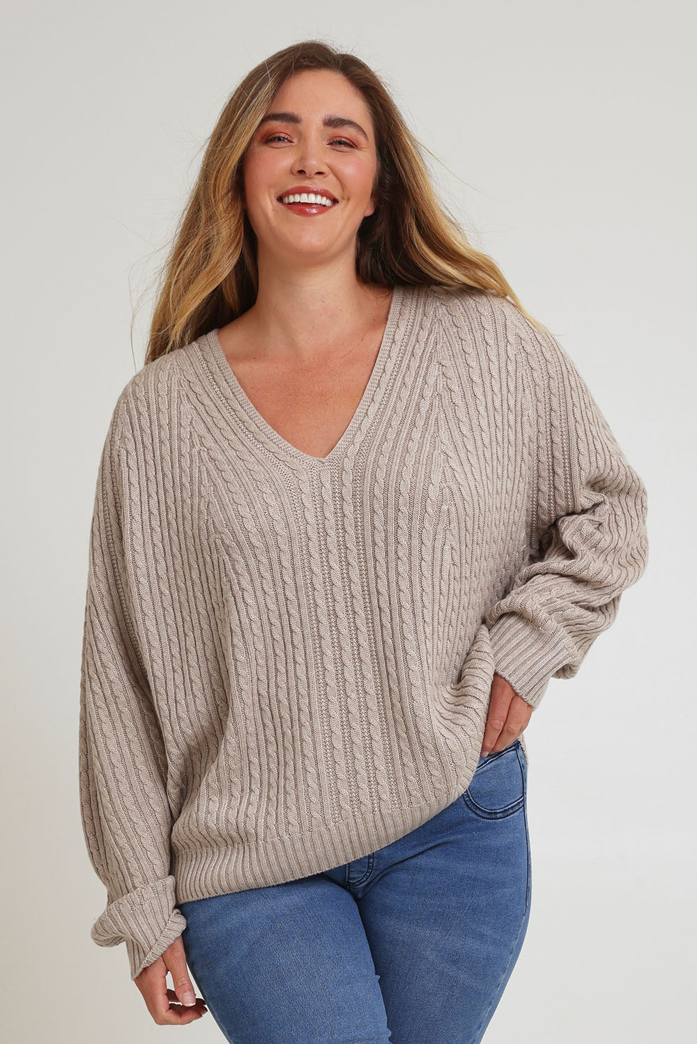 Model Chanel wearing size XL of the Ready And Cable Jumper in colour Sand, from the front, cropped image