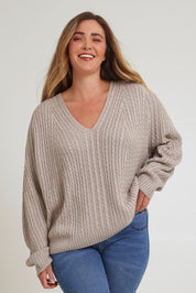 Model Chanel wearing size XL of the Ready And Cable Jumper in colour Sand, from the front, cropped image