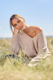 Model Tegan wearing size S of the Ready And Cable Jumper in colour Sand, from the front, showing the whole outfit
