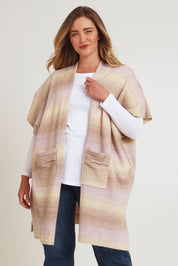Model Chanel wearing the Mountain Fields Cardi in colour Sunset (Pink), from the front, cropped image