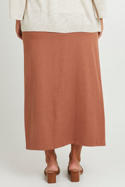 Model Monique wearing size 14 of the Carry Me With You Maxi Skirt in colour Rosewood, from the back
