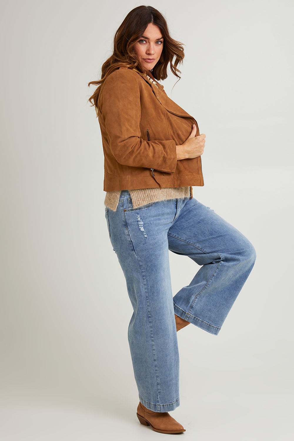 Model Laura wearing size 14 of the Come As You Are Suede Jacket in colour Tan, from the front, showing the whole outfit