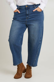 Model Laura wearing size 14 of the For All The Days Jeans in colour Denim (Blue), from the front, cropped image