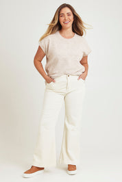 Model Chanel wearing size 16 of the Forever Cool Cord Jeans in colour Milk (White), from the front, showing the whole outfit