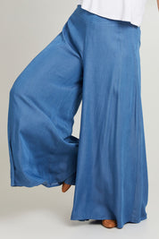 Model Laura wearing size 14 of the Easy Days Wide Leg Pants in colour Indigo (Blue), from the front, cropped image