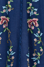 Product shot of the Fleur Muse Embroidered Dress in colour Navy (Blue), detail