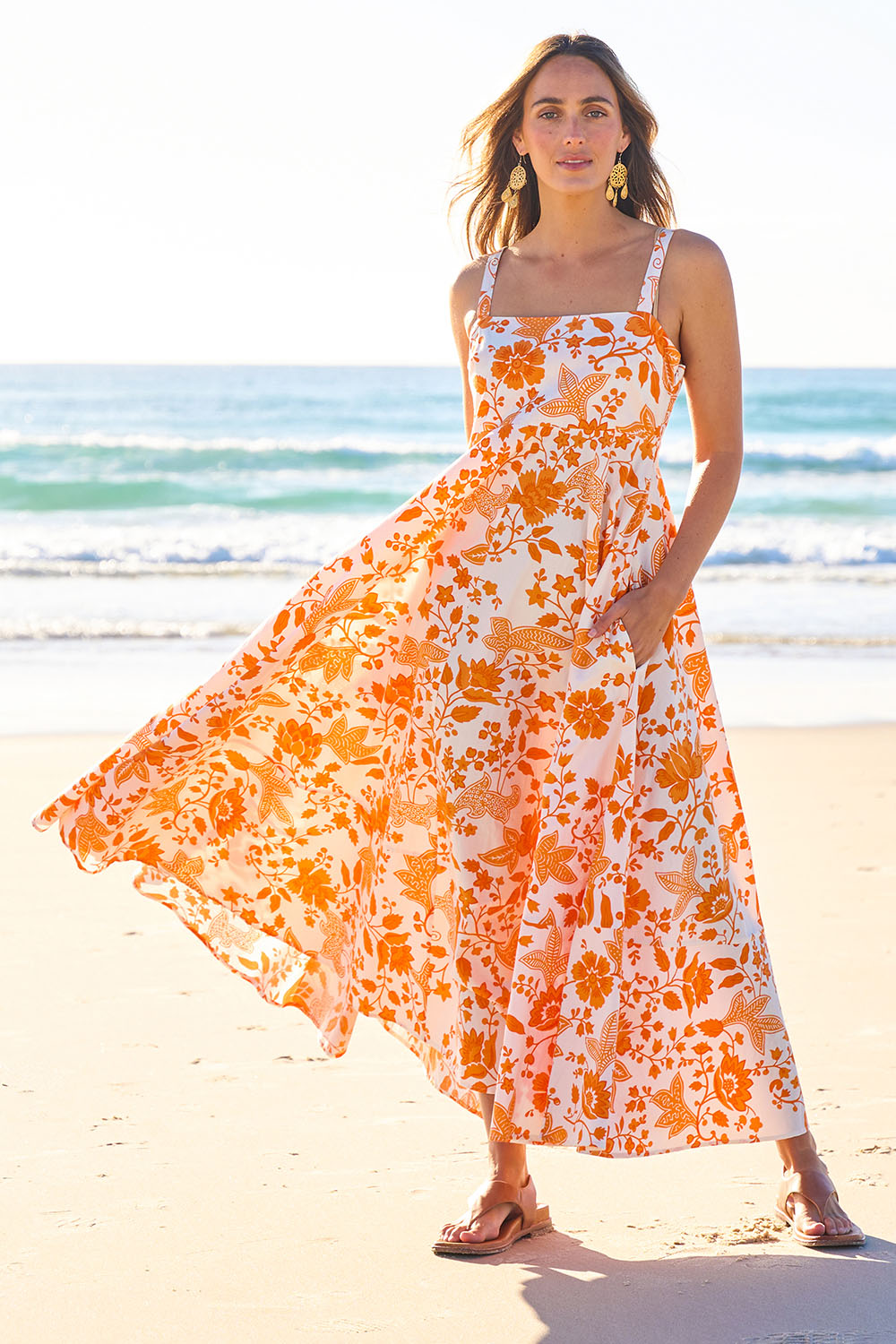 Model Tegan wearing size 10 of the Summer Fun Cotton Maxi Dress in colour Orangfleur, from the front, showing the whole outfit