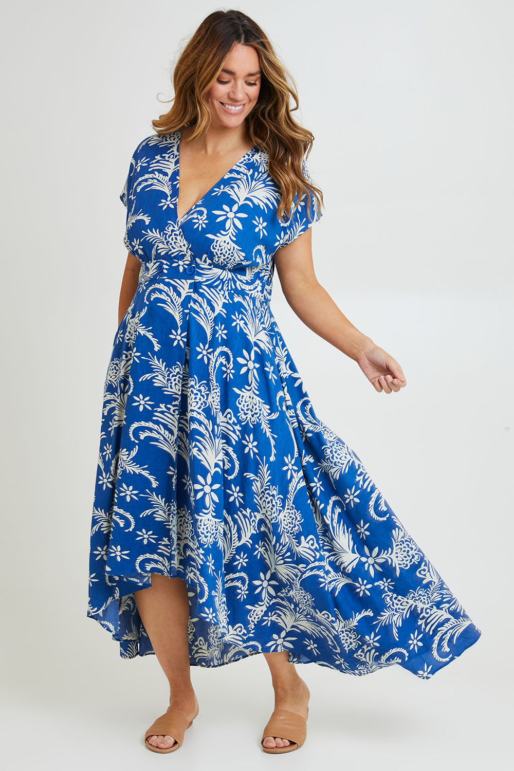 Model Laura wearing size 14 of the Double Take Wrap Dress in colour Bluefleur (Blue), from the front, showing the whole outfit