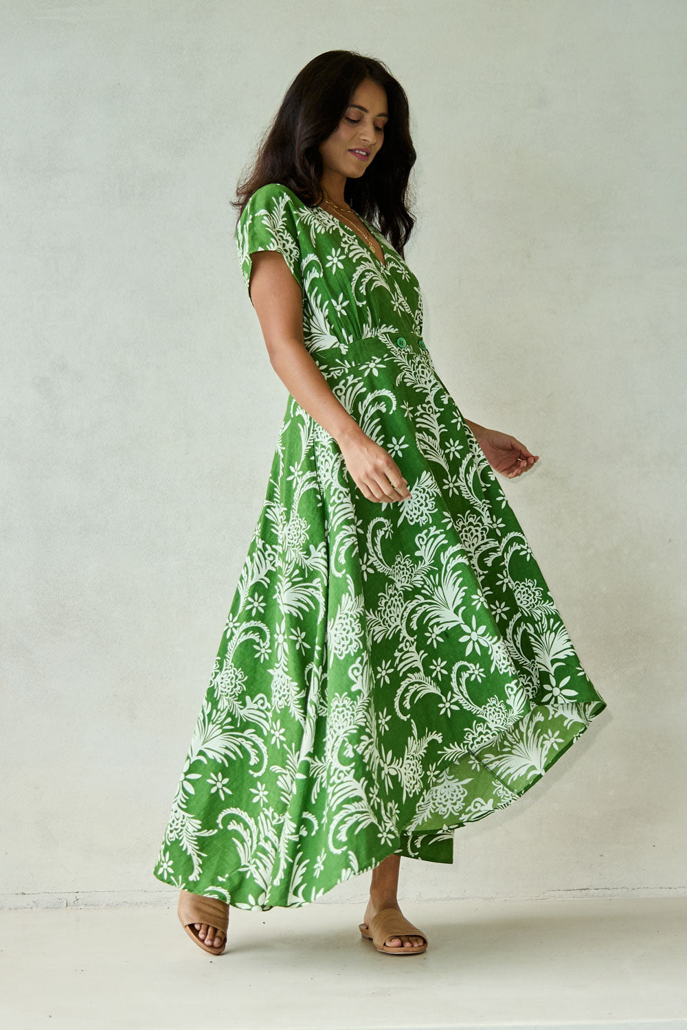Model Tahnee wearing size 10 of the Double Take Wrap Dress in colour Grnfleur (Green), from the front, showing the whole outfit