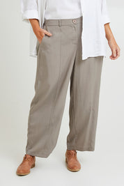 Model Laura wearing size 14 of the Feel Good Tencel Barrel Pants in colour Khaki (Green), from the front, cropped image