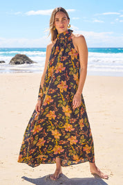 Model Tegan wearing size 10 of the Dream Daze Cotton Maxi Dress in colour Blackpink (Black), from the front, showing the whole outfit