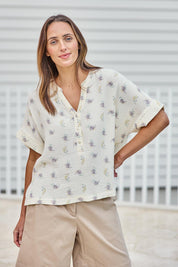 Model Tegand wearing size 10 of the Grandpa And Me Fleur Cotton Top – Creamfleur in colour Creamfleur, in a cropped view