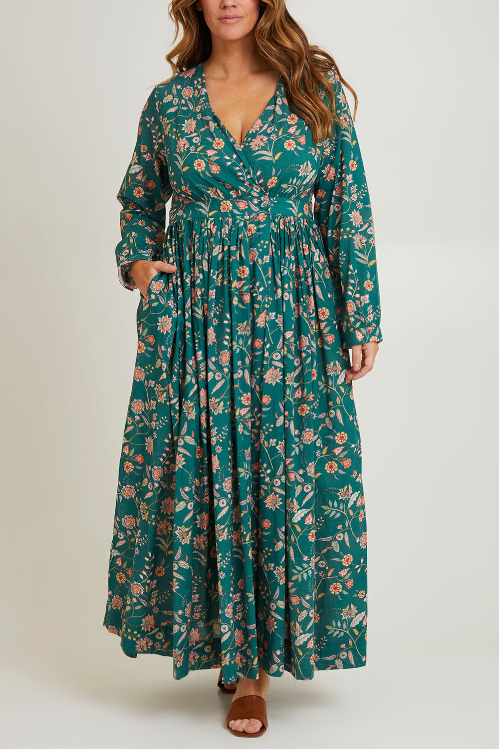 Model Laura wearing size 14 of the Divine Day Wrap Dress in colour Greenfleur (Green), from the front, cropped image