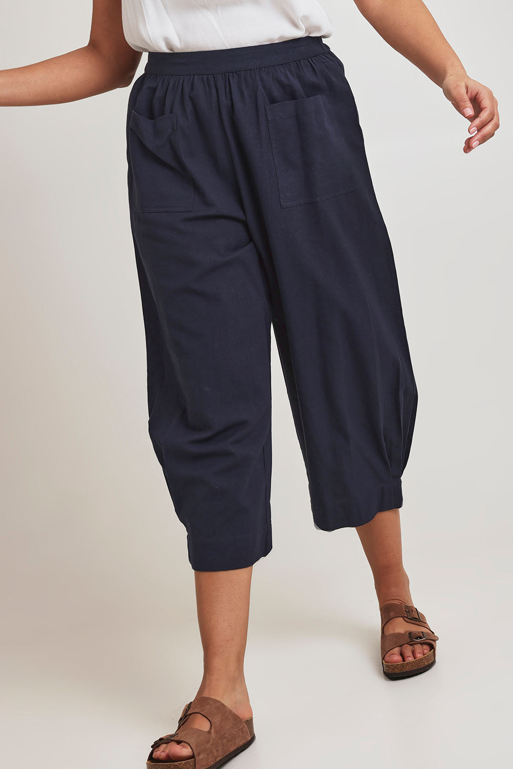 Model Terri-Leigh wearing size 14 of the You Had Me At First Glance Pants in colour Indigo (Blue), from the front, cropped image