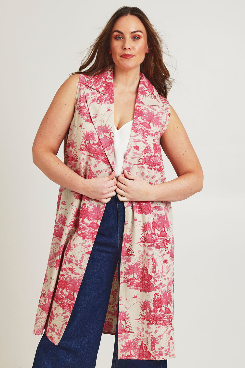 Model Jane wearing size 14 of the Toile De Jouy Vest in colour Pinktoile (Pink), from the front, cropped image