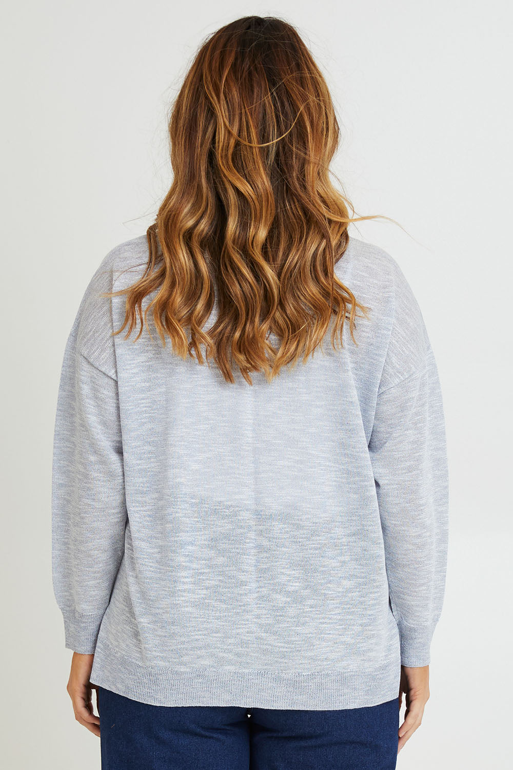 Model Laura wearing size L of the Go To Knit Boyfriend Henley in colour Sky (Blue), from the back