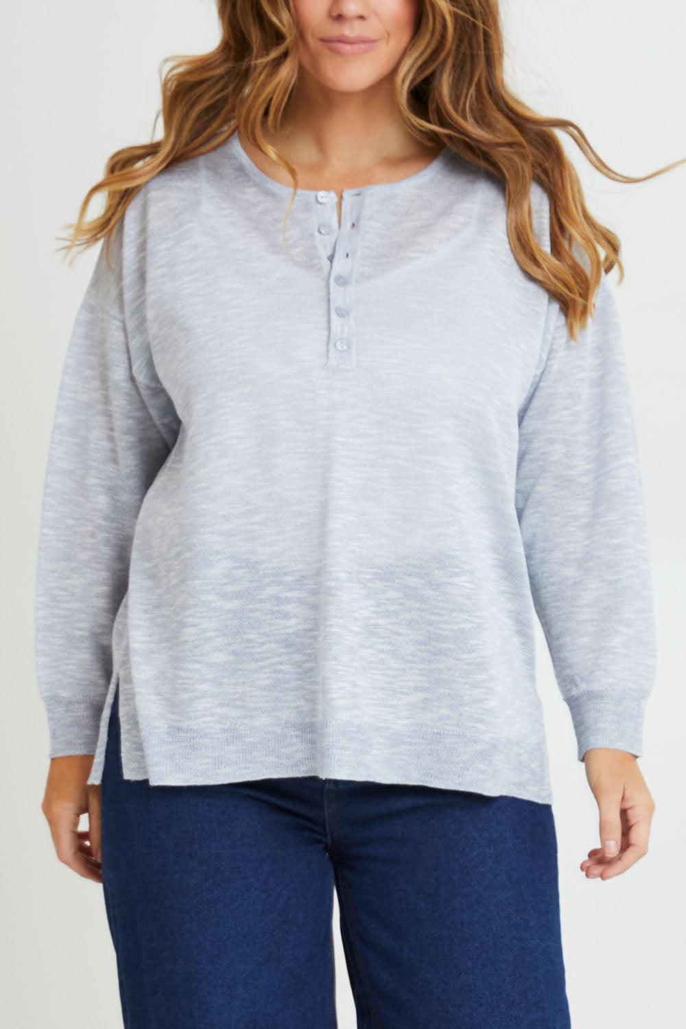 Model Laura wearing size L of the Go To Knit Boyfriend Henley in colour Sky (Blue), from the front, cropped image
