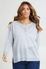 Model Laura wearing size L of the Go To Knit Boyfriend Henley in colour Sky (Blue), from the front, cropped image