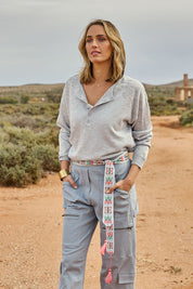 Model Tegan wearing size S of the Go To Knit Boyfriend Henley in colour Sky (Blue), from the front, showing the whole outfit
