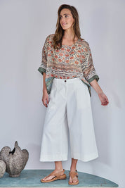 Model Tegand wearing size 10 of the Need You In My Life Cropped Pants - White in colour White, from the front