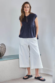 Model Tegand wearing size 10 of the Need You In My Life Cropped Pants - White in colour White, from the front
