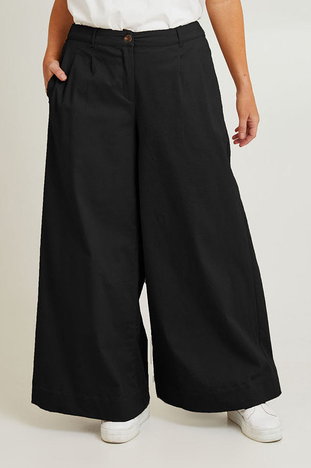 Model Laura wearing size 14 of the Need You In My Life Pants in colour Black (Black), from the front, cropped image