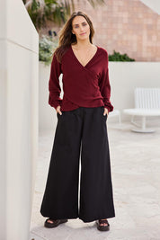 Model Tegand wearing size 10 of the Need You In My Life Pants - Black in colour Black, from the front