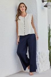 Model Tegand wearing size 10 of the Need You In My Life Pants - Navy in colour Navy, from the front