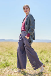 Model Tegan wearing size 10 of the Need You In My Life Pants in colour Steel (Grey), from the front, showing the whole outfit