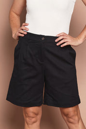Model Katie wearing size 10 of the Need You In My Life Shorts in colour Black (Black), from the front, cropped image