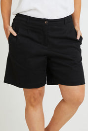 Model Laura wearing size 14 of the Need You In My Life Shorts in colour Black (Black), from the front, cropped image