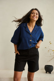 Model Tahnee wearing size 10 of the Need You In My Life Shorts in colour Black (Black), from the front, showing the whole outfit
