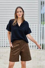 Model Tegand wearing size 10 of the Need You In My Life Shorts – Chocolate in colour Chocolate, in a cropped view