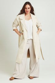 Model Jane wearing size 14 of the Summertime Love Linen Cotton Trench Coat in colour Natural, from the front, showing the whole outfit