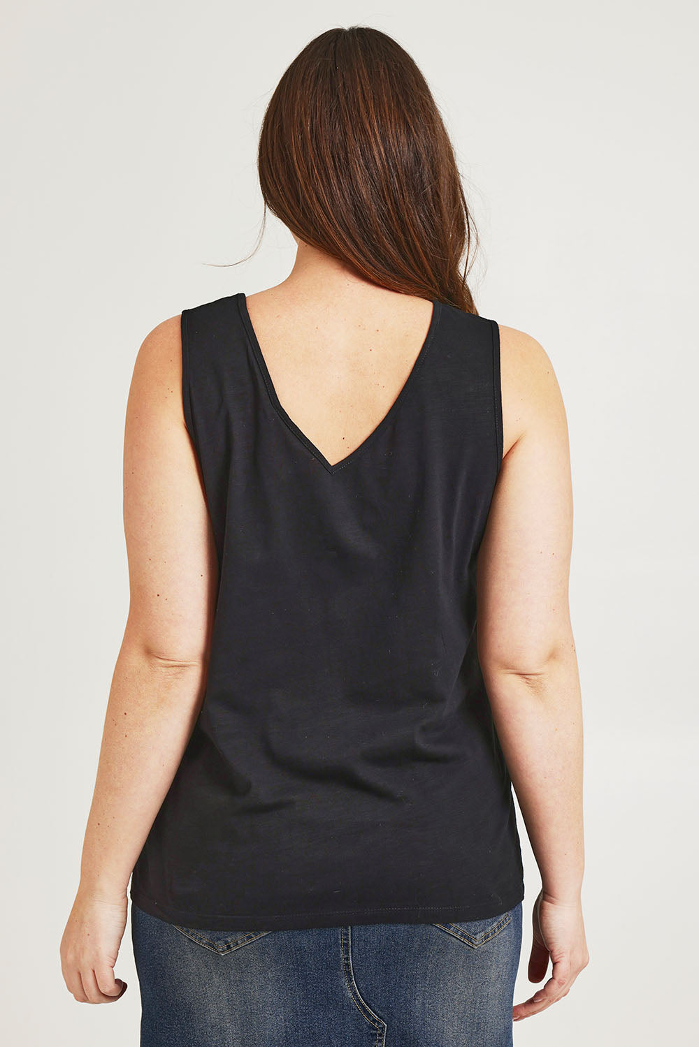 Model Jane wearing size 14 of the Need You Double Vee Tank in colour Black (Black), from the back