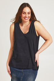 Model Jane wearing size 14 of the Need You Double Vee Tank in colour Black (Black), from the front, cropped image