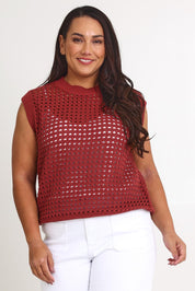 Model Ashleigh wearing size XL of the Love Language Cotton Vest in colour Rust, from the front, cropped image